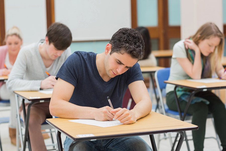 Students taking a test in a classroom in Oakland